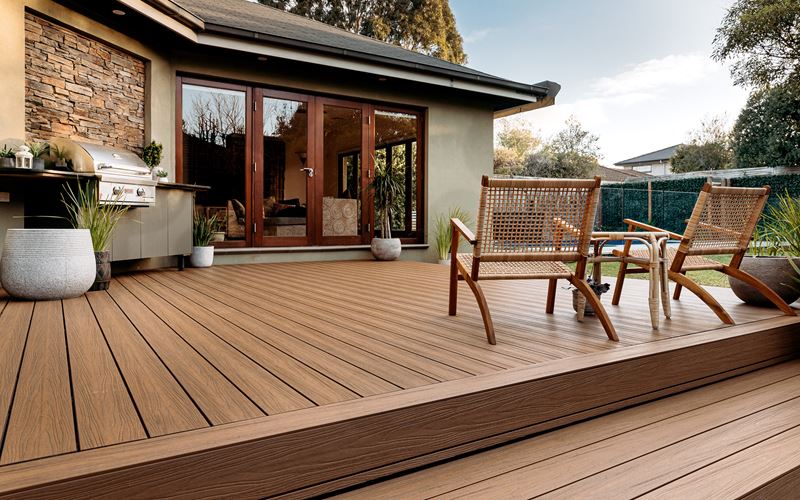 light brown composite deck furnished with chairs.