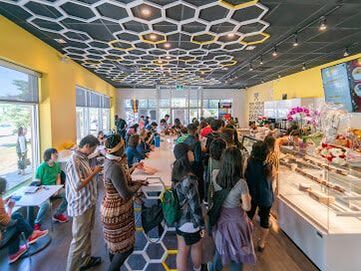 Interior of a bubble tea shop with a large crowd in Elgin Mill, Richmond Hill, ON